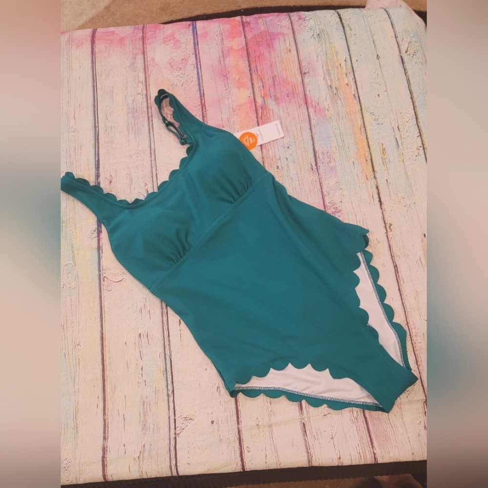Teal swimsuit with gold hardware